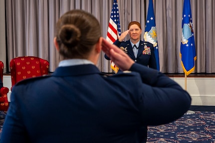 U.S. Air Force Lt. Col. Kathryn Kenan, commander of the 5th Intelligence Support Squadron receives her first salute from Lt. Col. Sarah Peterson, 5th ISS Director of Operations, during an assumption of command ceremony at Joint Base Anacostia-Bolling, July 29, 2025.