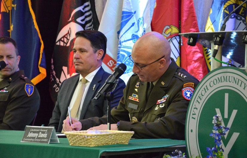 Lieutenant Gen. Johnny Davis, U.S. Army Recruiting Command commanding general, Brig. Gen. Justin Mann, Indiana National Guard director of the joint staff, and Dr. Marty Pollio, Ivy Tech Community College president, marked the start of the Army program by penning their signatures to a partnership agreement designed to introduce two-year community college students to pathways for military and public service.