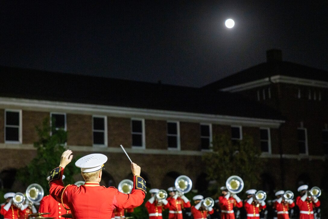 "The Commandant's Own" United States Marine Drum & Bugle Corps, performs during the Friday Evening Parade at Marine Barracks Washington, D.C., Aug. 8, 2025. The Evening Parade is a symbol of tradition and heritage of the Marine Corps. This parade was hosted Lt. Gen. Leonard Anderson IV, commander, United States Marine Corps Forces Reserves and Marine Corps Forces South, in honor of Mr. Greg Norman, Chief Executive Officer, Chairman and founder of the Greg Norman Company. (U.S. Marine Corps photo by Sgt. Samuel Qin)