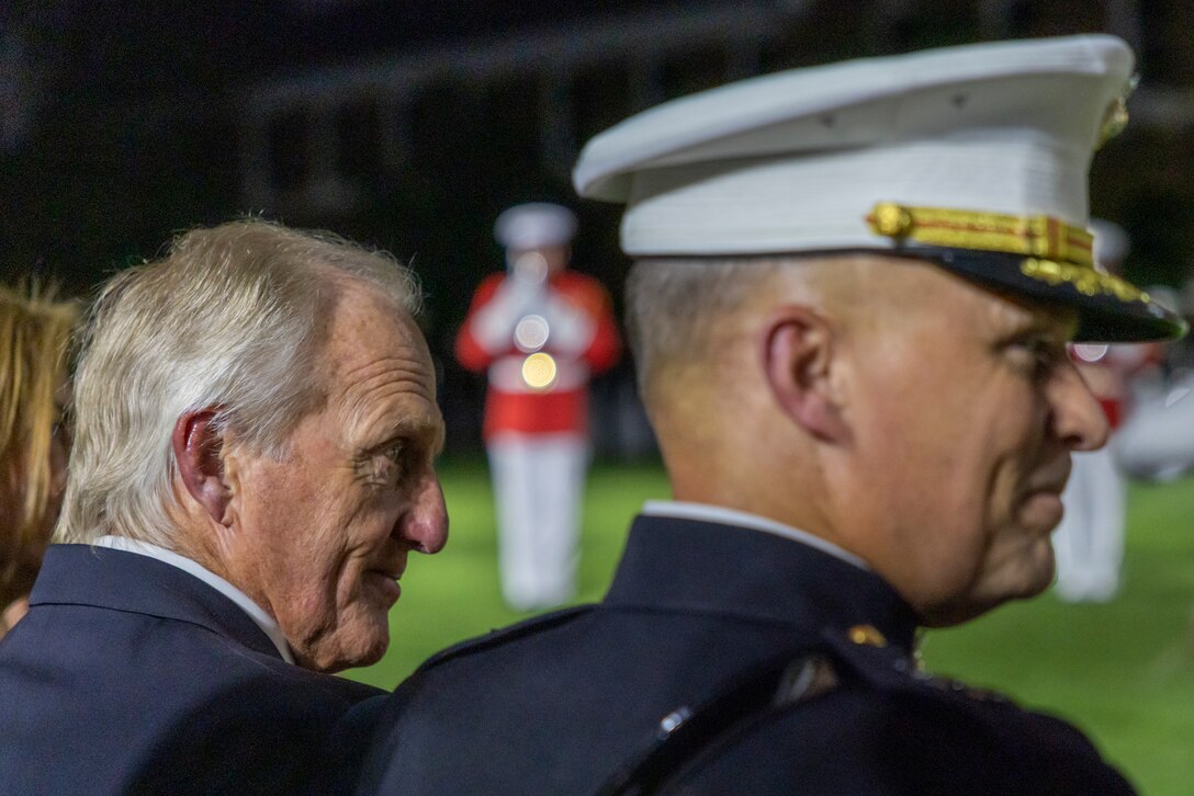 U.S. Marine Corps Lt. Gen. Leonard F. Anderson IV, right, commander of Marine Forces Reserve and Marine Forces South, and Mr. Greg Norman, Chief Executive Officer, Chairman and founder of the Greg Norman Company, watch the Friday Evening Parade at Marine Barracks Washington, D.C., Aug. 8, 2025. Norman was the guest of honor for the Evening Parade. (U.S. Marine Corps photo by Sgt. Samuel Qin)