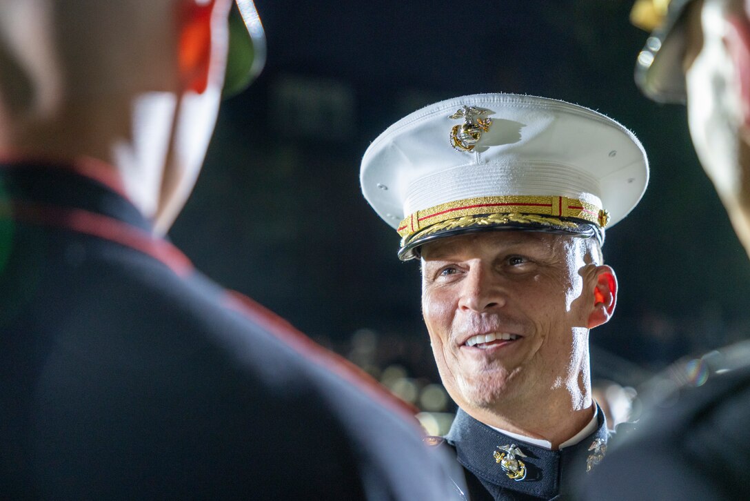 U.S. Marine Corps Lt. Gen. Leonard F. Anderson IV, commander of Marine Forces Reserve and Marine Forces South, thanks members of the "The Commandant's Own" U.S. Marine Corps Drum & Bugle Corps after a performance at the Friday Evening Parade at Marine Barracks Washington, D.C., Aug. 8, 2025. The Friday Evening Parade is a symbol of tradition and heritage of the Marine Corps. This parade, hosted by Anderson was held in honor of Mr. Greg Norman, Chief Executive Officer, Chairman and founder, Greg Norman Company. (U.S. Marine Corps photo by Sgt. Samuel Qin)