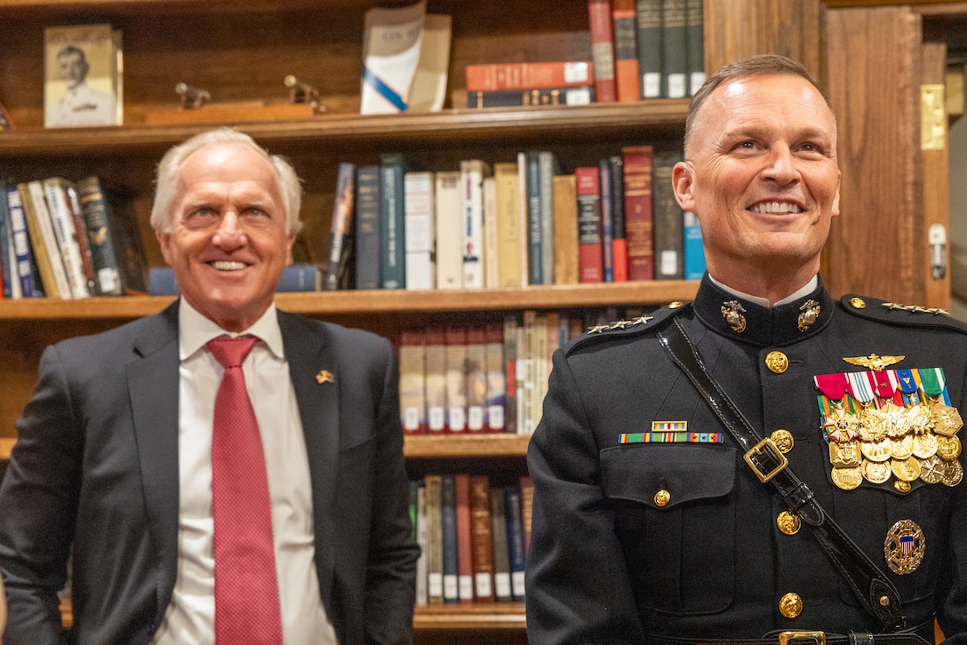 U.S. Marine Corps Lt. Gen. Leonard F. Anderson IV, right, commander of Marine Forces Reserve and Marine Forces South, and Mr. Greg Norman, left, Chief Executive Officer, Chairman and founder of the Greg Norman Company, receives a tour prior to a Friday Evening Parade at Marine Barracks Washington, D.C., Aug. 8, 2025. Norman was the guest of honor for the Evening Parade. (U.S. Marine Corps photo by Sgt. Samuel Qin)