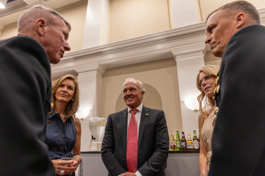 U.S. Marine Corps Lt. Gen. Leonard F. Anderson IV, right, commander of Marine Forces Reserve and Marine Forces South, and Mr. Greg Norman, middle, Chief Executive Officer, Chairman and founder of the Greg Norman Company, along with their spouses speak with the 39th Commandant of the Marine Corps, Gen. Eric M. Smith, prior to a Friday Evening Parade at Marine Barracks Washington, D.C., Aug. 8, 2025. Norman was the guest of honor for the Evening Parade. (U.S. Marine Corps photo by Sgt. Samuel Qin)