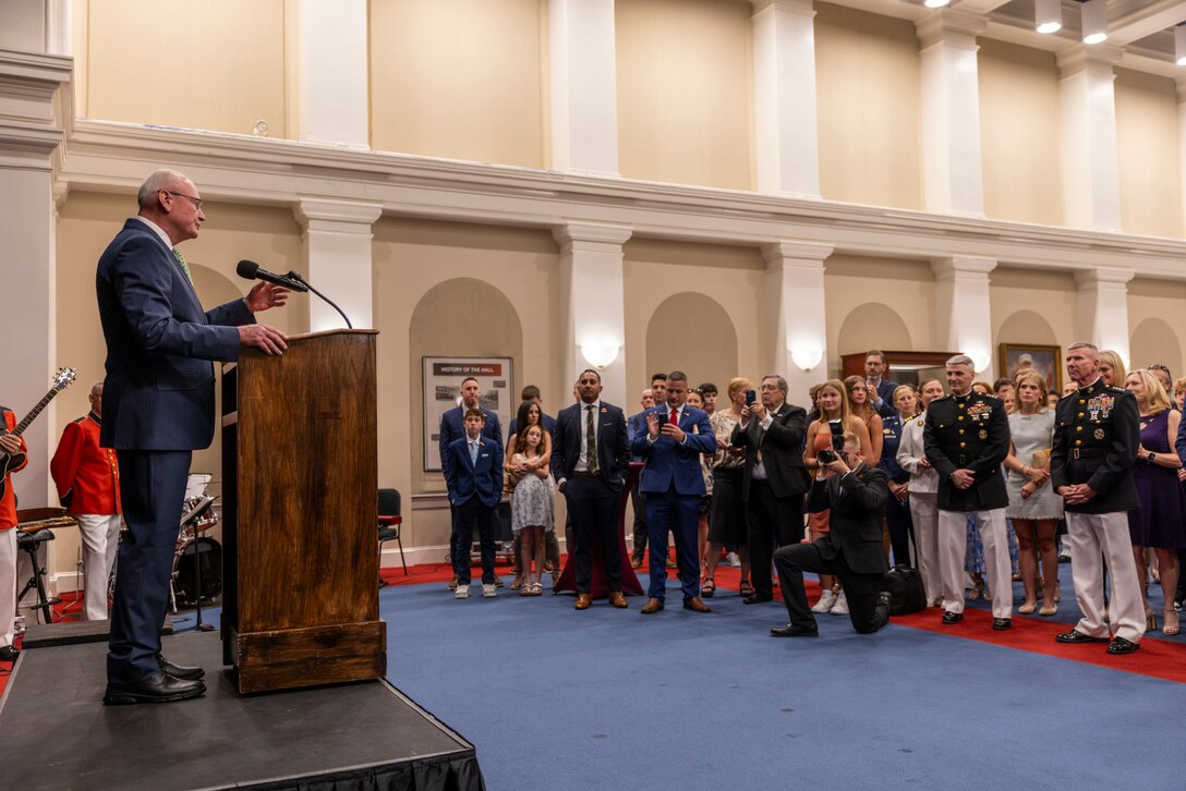 Retired U.S. Marine Corps Lt. Gen. James B. Laster, middle, Toys for Tots Foundation President & CEO, speaks at a reception prior to a Friday Evening Parade at Marine Barracks Washington, D.C., Aug. 8, 2025. The Friday Evening Parade is a symbol of tradition and heritage of the Marine Corps. This parade, hosted by U.S. Marine Corps Lt. Gen. Leonard F. Anderson IV, commander of Marine Forces Reserve and Marine Forces South, was held in honor of Mr. Greg Norman, Chief Executive Officer, Chairman and founder, Greg Norman Company. (U.S. Marine Corps photo by Sgt. Samuel Qin)