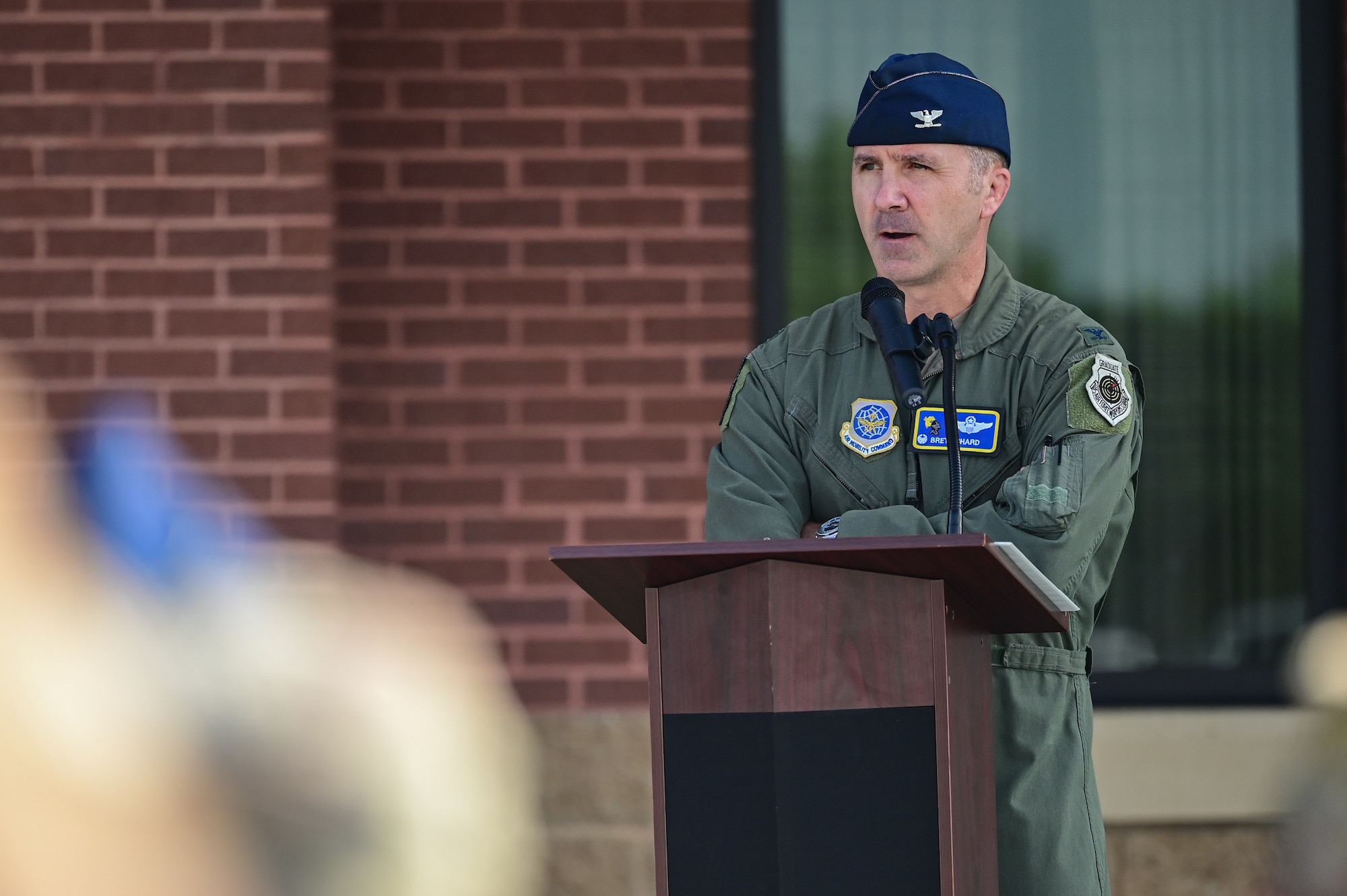 U.S. Air Force Col. Bret Echard, 19th Airlift Wing and installation commander, speaks at a ribbon cutting ceremony for new dorms at Little Rock Air Force Base, Arkansas, Aug. 12, 2025. The layout of the new dorms is designed to incorporate a social element into Airmen’s living standards by including a common area in each suite.