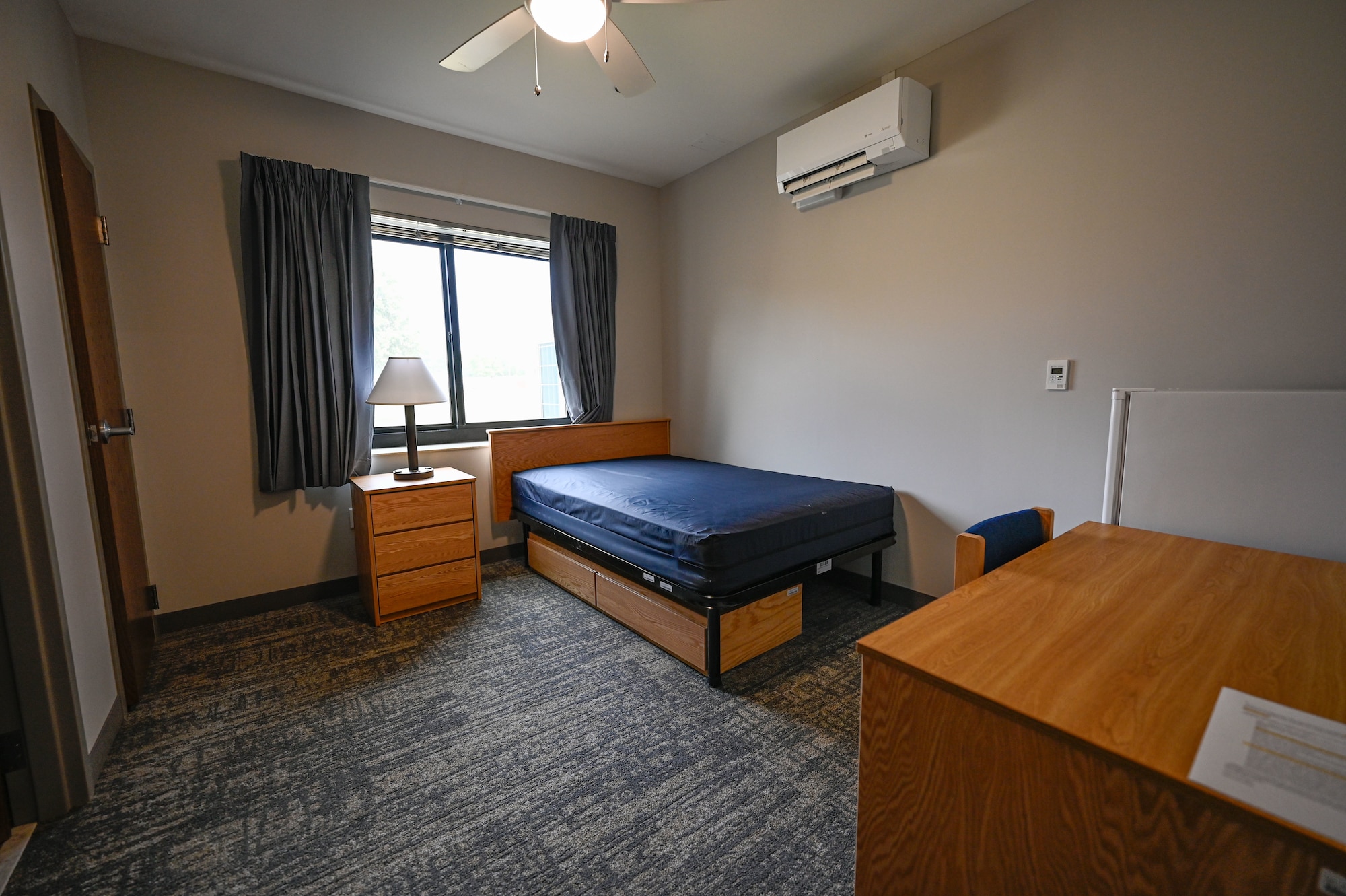 A fully furnished bedroom is on display during a tour of new dorms at Little Rock Air Force Base, Arkansas, Aug. 12, 2025. The layout of the new dorms is designed to incorporate a social element into Airmen’s living standards by including a common area in each suite.