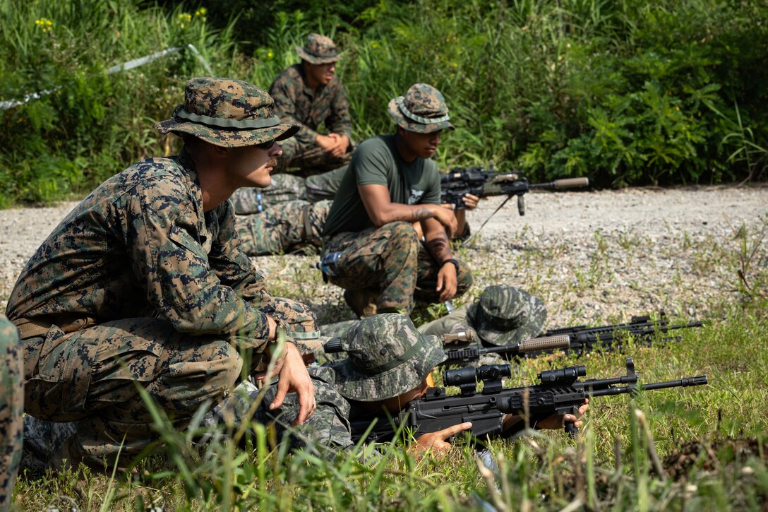 U.S. Marines with 2nd Battalion, 23rd Marines, forward deployed with 4th Marine Regiment, 3rd Marine Division as part of the Unit Deployment Program, and Republic of Korea Marines rehearse reacting to contact during the Korean Marine Exercise Program 25.2 in Pocheon, South Korea, July 28, 2025. KMEP is conducted regularly between the ROK and U.S. Marine Corps to increase their combined capabilities through realistic training geared towards deterrence and maintaining peace in the Indo-Pacific. (U.S. Marine Corps photo by Lance Cpl. Van Hoang)