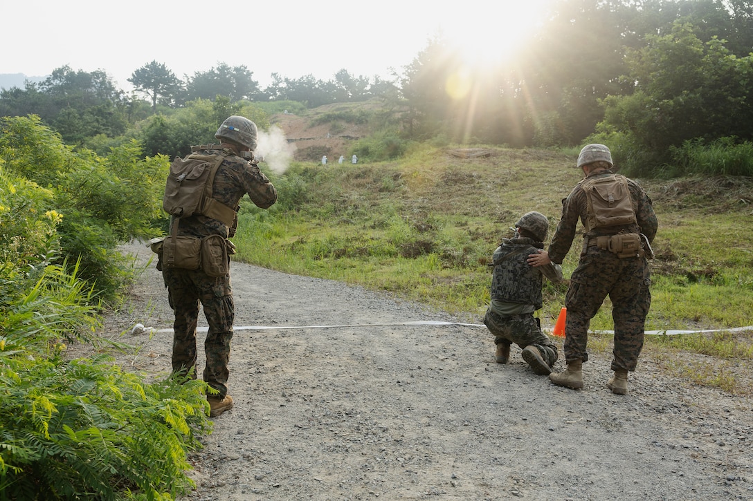 U.S. Marines with 2nd Battalion, 23rd Marines, forward deployed with 4th Marine Regiment, 3d Marine Division as part of the Unit Deployment Program, and Republic of Korea Marines conduct a reaction to contact drill during the Korean Marine Exercise Program 25.2 in Pocheon, South Korea, July 29, 2025. KMEP is conducted regularly between the ROK and U.S. Marine Corps to increase their combined capabilities through realistic training geared towards deterrence and maintaining peace in the Indo-Pacific. (U.S. Marine Corps photo by Lance Cpl. Van Hoang)