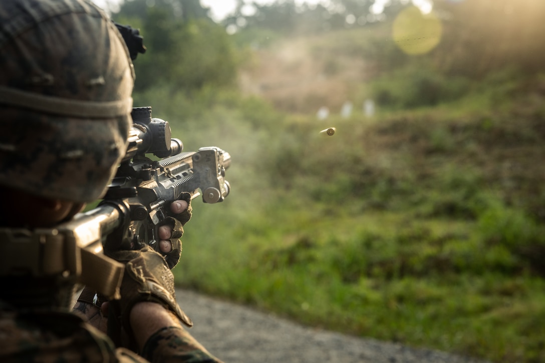 A U.S. Marine with 2nd Battalion, 23rd Marines, forward deployed with 4th Marine Regiment, 3d Marine Division as part of the Unit Deployment Program, fires at targets during a reaction to contact drill during the Korean Marine Exercise Program 25.2 in Pocheon, South Korea, July 29, 2025. KMEP is conducted regularly between the ROK and U.S. Marine Corps to increase their combined capabilities through realistic training geared towards deterrence and maintaining peace in the Indo-Pacific. (U.S. Marine Corps photo by Lance Cpl. Van Hoang)