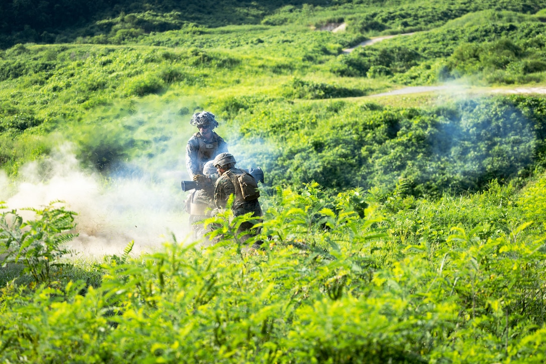 U.S. Marines with 2nd Battalion, 23rd Marines, forward deployed with 4th Marine Regiment, 3d Marine Division as part of the Unit Deployment Program, fire an M3E1 Multi-purpose Anti-armor Anti-personnel Weapon System during the Korean Marine Exercise Program 25.2 in Pocheon, South Korea, July 29, 2025. KMEP is conducted regularly between the ROK and U.S. Marine Corps to increase their combined capabilities through realistic training geared towards deterrence and maintaining peace in the Indo-Pacific. (U.S. Marine Corps photo by Lance Cpl. Van Hoang)