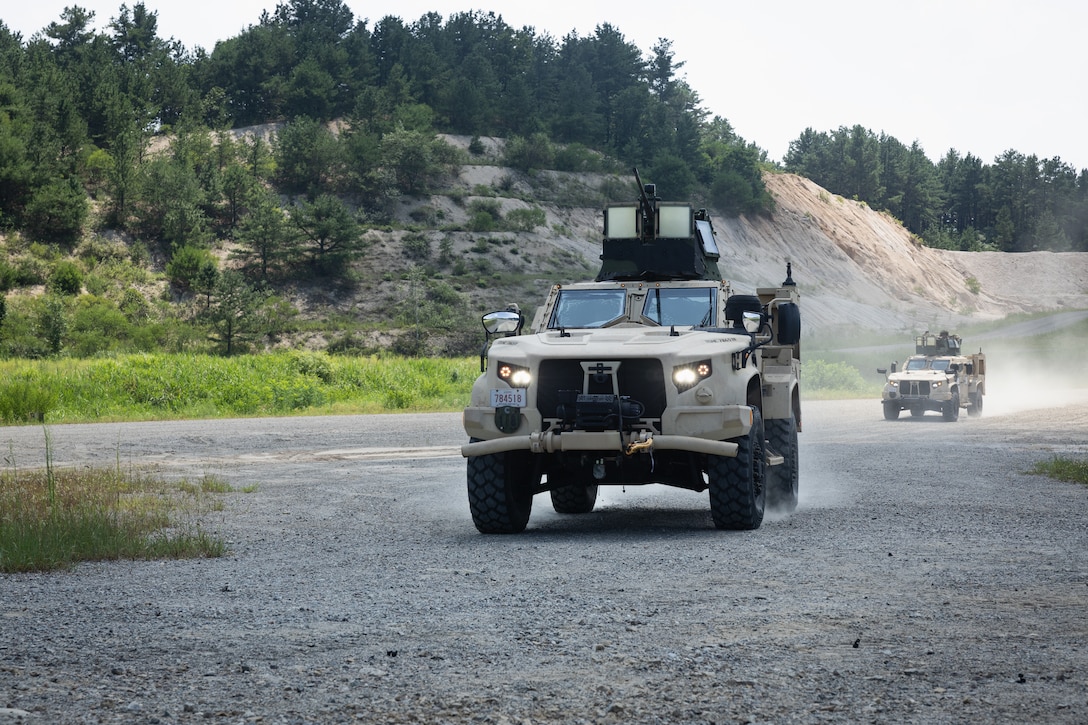 U.S. Marines with 2nd Battalion, 23rd Marines, forward deployed with 4th Marine Regiment, 3d Marine Division as part of the Unit Deployment Program, drive two U.S. Marine Corps Joint Tactical Light Vehicles into firing positions at a machine gun range during the Korean Marine Exercise Program 25.2 in Pocheon, South Korea, July 29, 2025. KMEP is conducted regularly between the ROK and U.S. Marine Corps to increase their combined capabilities through realistic training geared towards deterrence and maintaining peace in the Indo-Pacific. (U.S. Marine Corps photo by Lance Cpl. Van Hoang)