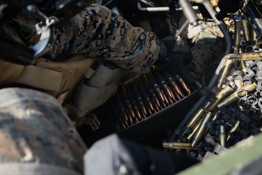 U.S. Marine Corps Cpl. Christian Juan, a machine gunner with 2nd Battalion, 23rd Marines, forward deployed with 4th Marine Regiment, 3d Marine Division as part of the Unit Deployment Program, opens a new box of ammunition to reload an M2 .50 caliber machine gun during the Korean Marine Exercise Program 25.2 in Pocheon, South Korea, July 29, 2025. KMEP is conducted regularly between the ROK and U.S. Marine Corps to increase their combined capabilities through realistic training geared towards deterrence and maintaining peace in the Indo-Pacific. (U.S. Marine Corps photo by Lance Cpl. Van Hoang)