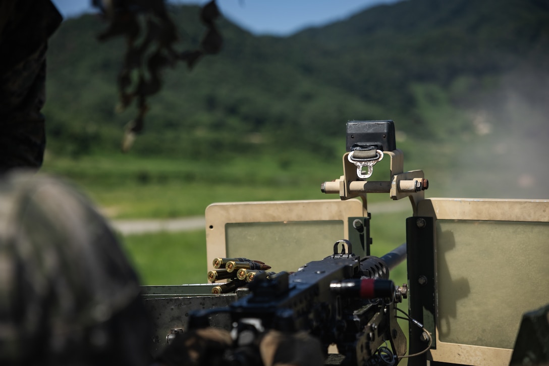 A Republic of Korea Marine fires an M2 .50 caliber machine gun during the Korean Marine Exercise Program 25.2 in Pocheon, South Korea, July 29, 2025. KMEP is conducted regularly between the ROK and U.S. Marine Corps to increase their combined capabilities through realistic training geared towards deterrence and maintaining peace in the Indo-Pacific. (U.S. Marine Corps photo by Lance Cpl. Van Hoang)