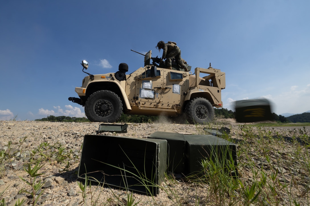 U.S. Marines with 2nd Battalion, 23rd Marines, forward deployed with 4th Marine Regiment, 3d Marine Division as part of the Unit Deployment Program, reload an M2 .50 caliber machine gun during the Korean Marine Exercise Program 25.2 in Pocheon, South Korea, July 29, 2025. KMEP is conducted regularly between the ROK and U.S. Marine Corps to increase their combined capabilities through realistic training geared towards deterrence and maintaining peace in the Indo-Pacific. (U.S. Marine Corps photo by Lance Cpl. Van Hoang)