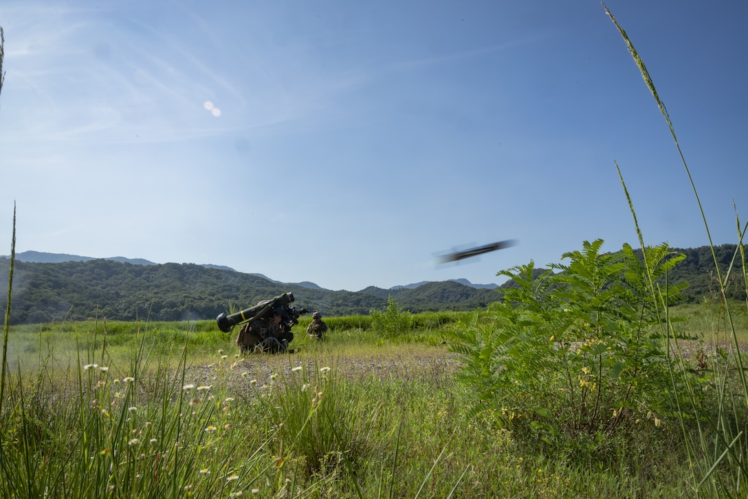 U.S. Marine Corps Cpl. Dwight Beal, an anti-tank missile gunner with 2nd Battalion, 23rd Marines, forward deployed with 4th Marine Regiment, 3d Marine Division as part of the Unit Deployment Program, fires a Javelin shoulder-fired anti-tank missile during the Korean Marine Exercise Program 25.2 in Pocheon, South Korea, July 29, 2025. KMEP is conducted regularly between the ROK and U.S. Marine Corps to increase their combined capabilities through realistic training geared towards deterrence and maintaining peace in the Indo-Pacific. (U.S. Marine Corps photo by Lance Cpl. Van Hoang)