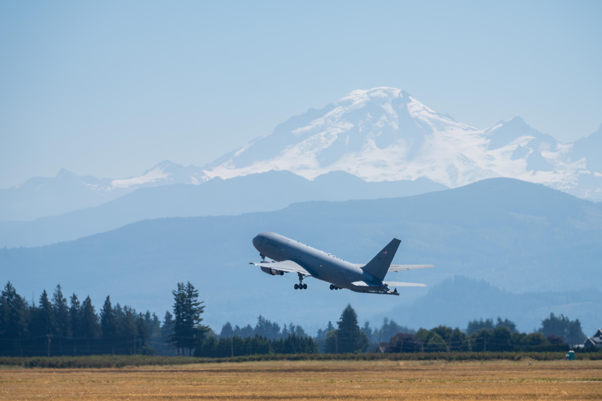 A U.S. Air Force KC-46 Pegasus aircraft assigned to the 56th Air Refueling Squadron takes off at the Abbotsford International Airport, Canada, Aug. 10, 2025. The KC-46 is the newest tanker aircraft in the Air Force’s fleet, which can carry an additional 12,000 pounds of fuel than the KC-135 Stratotanker. (U.S. Air Force photo by Airman 1st Class Lauren Torres)