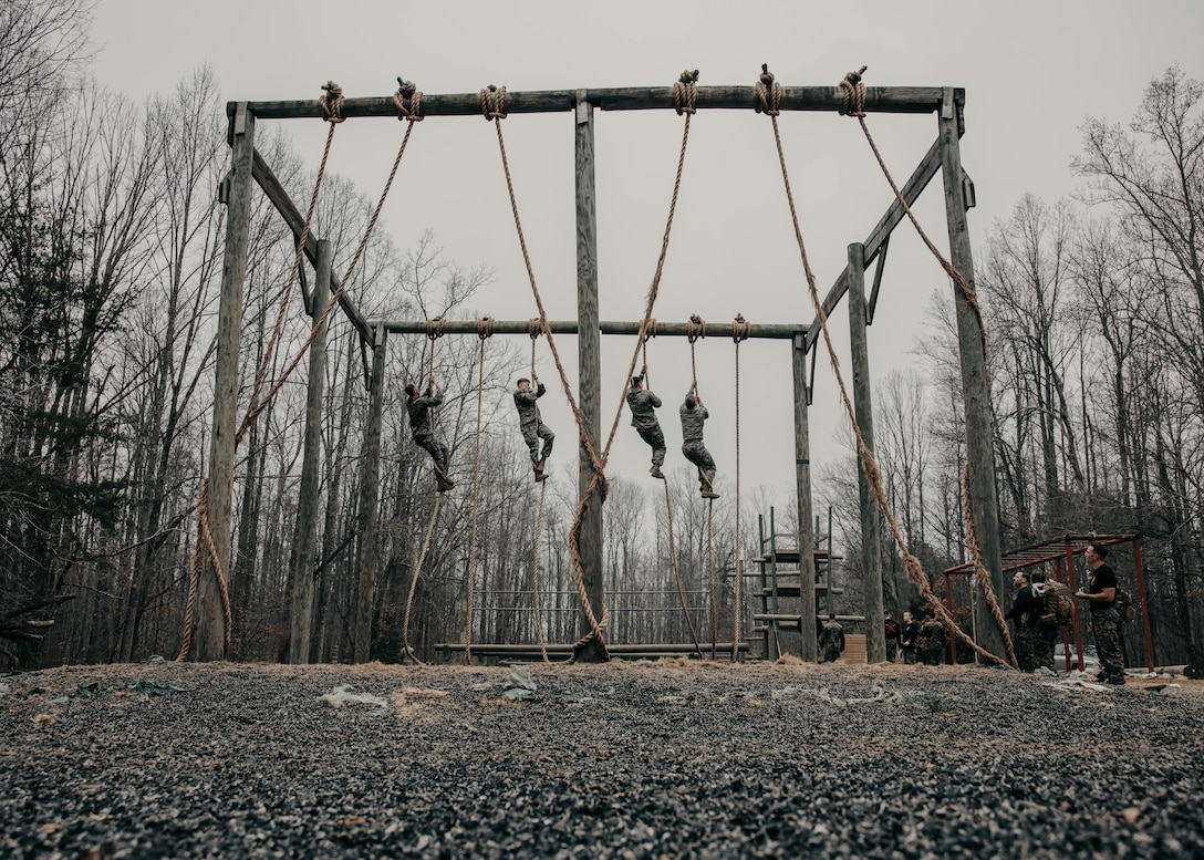 Students with the Force Fitness Instructor Course conduct the obstacle course evaluation at The Basic School on Marine Corps Base Quantico, Virginia, March 14, 2025. Marines go through a seven-week long Force Fitness Instructor Course allowing Marines to learn how to lead workouts safely and effectively by following a fitness regimen that is designed specifically to meet a unit’s fitness goals and needs. (U.S. Marine Corps photo by Lance Cpl. Harleigh Faulk)