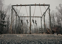 Students with the Force Fitness Instructor Course conduct the obstacle course evaluation at The Basic School on Marine Corps Base Quantico, Virginia, March 14, 2025. Marines go through a seven-week long Force Fitness Instructor Course allowing Marines to learn how to lead workouts safely and effectively by following a fitness regimen that is designed specifically to meet a unit’s fitness goals and needs. (U.S. Marine Corps photo by Lance Cpl. Harleigh Faulk)