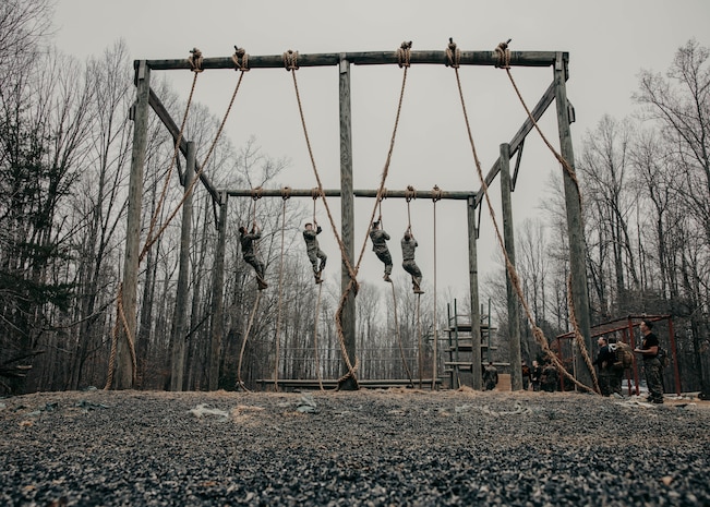 Students with the Force Fitness Instructor Course conduct the obstacle course evaluation at The Basic School on Marine Corps Base Quantico, Virginia, March 14, 2025. Marines go through a seven-week long Force Fitness Instructor Course allowing Marines to learn how to lead workouts safely and effectively by following a fitness regimen that is designed specifically to meet a unit’s fitness goals and needs. (U.S. Marine Corps photo by Lance Cpl. Harleigh Faulk)