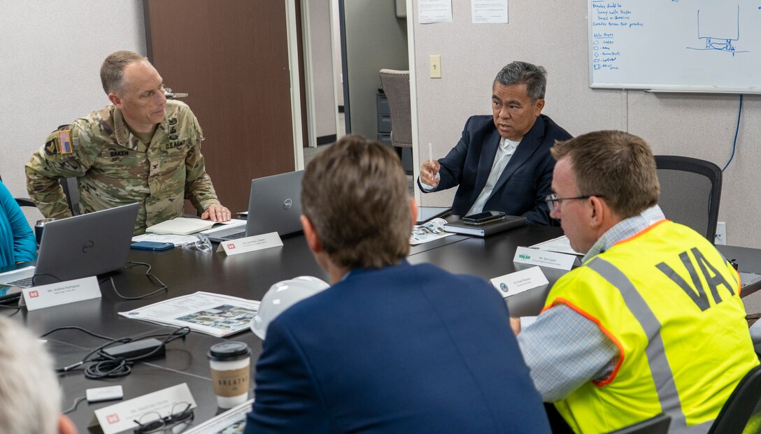 U.S. Army Corps of Engineers South Pacific Division Regional Business Director Brian Kamisato, second from right, chairs a meeting with USACE and Department of Veterans Affairs leaders, contractors and project delivery team members Aug. 7 at the LA District’s San Diego Resident Office at the Jennifer Moreno Veterans Affairs Medical Center in San Diego to discuss the final stretch of construction.