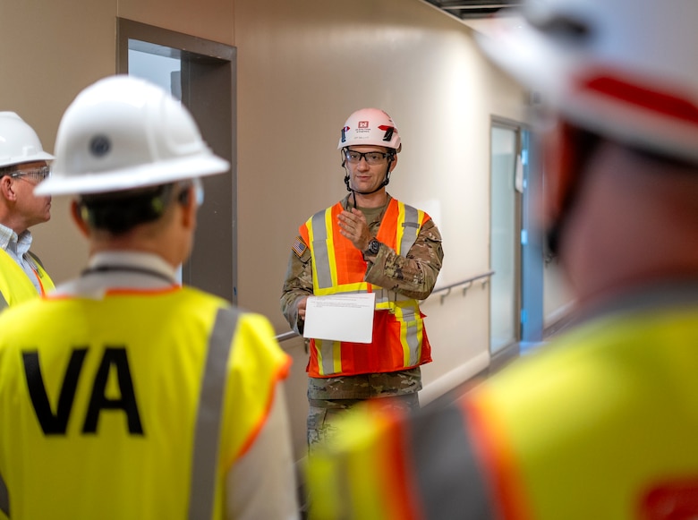 Capt. Gregory Sacenti, project engineer with the U.S. Army Corps of Engineers Los Angeles District, center, leads a tour of the nearly complete Spinal Cord Injury/Community Living Center Aug. 7 at the Jennifer Moreno Veterans Affairs Medical Center in San Diego.