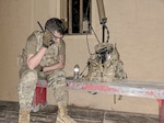Spc. Robert Bowley, an electromagnetic warfare specialist with the 37th Infantry Brigade Combat Team, radios from his position while monitoring the electromagnetic spectrum with the Beast+ system during Northern Strike at Camp Grayling, Michigan, on Aug. 12, 2025.