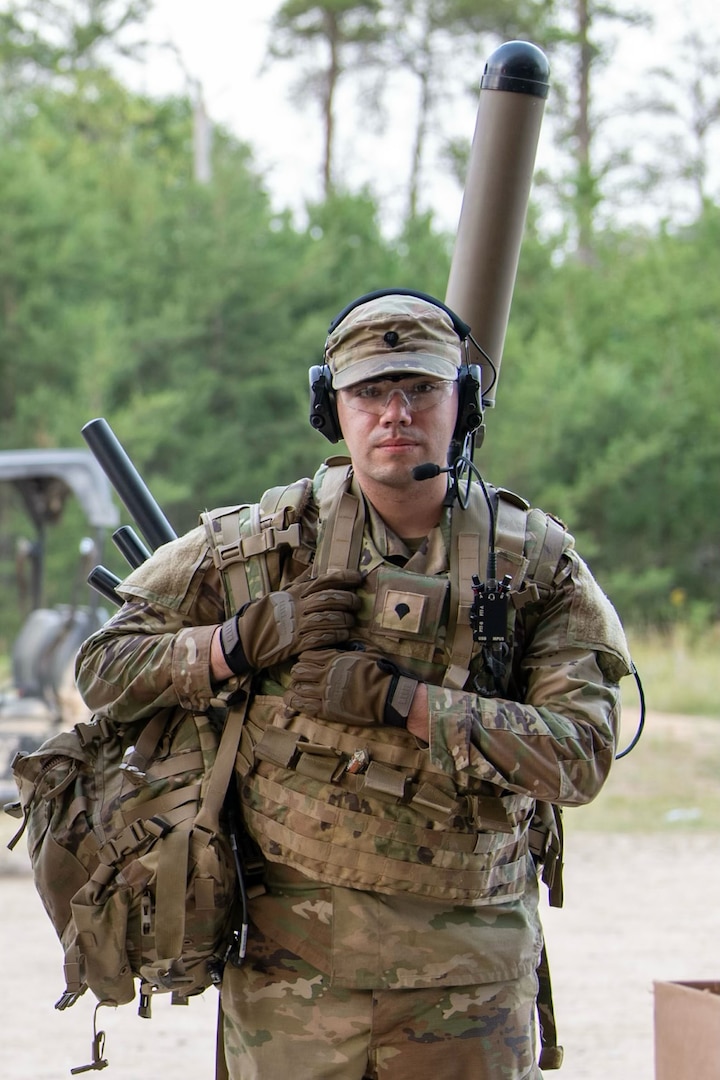 Spc. Robert Bowley, an electromagnetic warfare specialist with the 37th Infantry Brigade Combat Team, prepares to monitor the electromagnetic spectrum with the Beast+ system during Northern Strike at the Combined Arms Collective Training Facility, Camp Grayling, Michigan, Aug. 12, 2025.