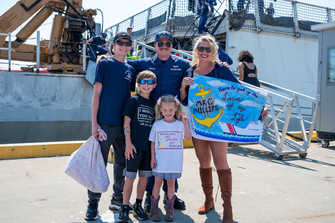 Chief Petty Officer Colin Phillips, a machinery technician aboard U.S. Coast Guard Cutter Bertholf (WMSL 750) reunites with his family at the pier during the ship's return to home port in Alameda, California Aug. 10, 2025. Bertholf deployed in support of Operation BORDER TRIDENT, Coast Guard Southwest District’s (CGD-SW) standing operation to counter-illicit maritime activity along the Southwest maritime border. (U.S. Coast Guard photo by Petty Officer 3rd Class Austin Wiley)
