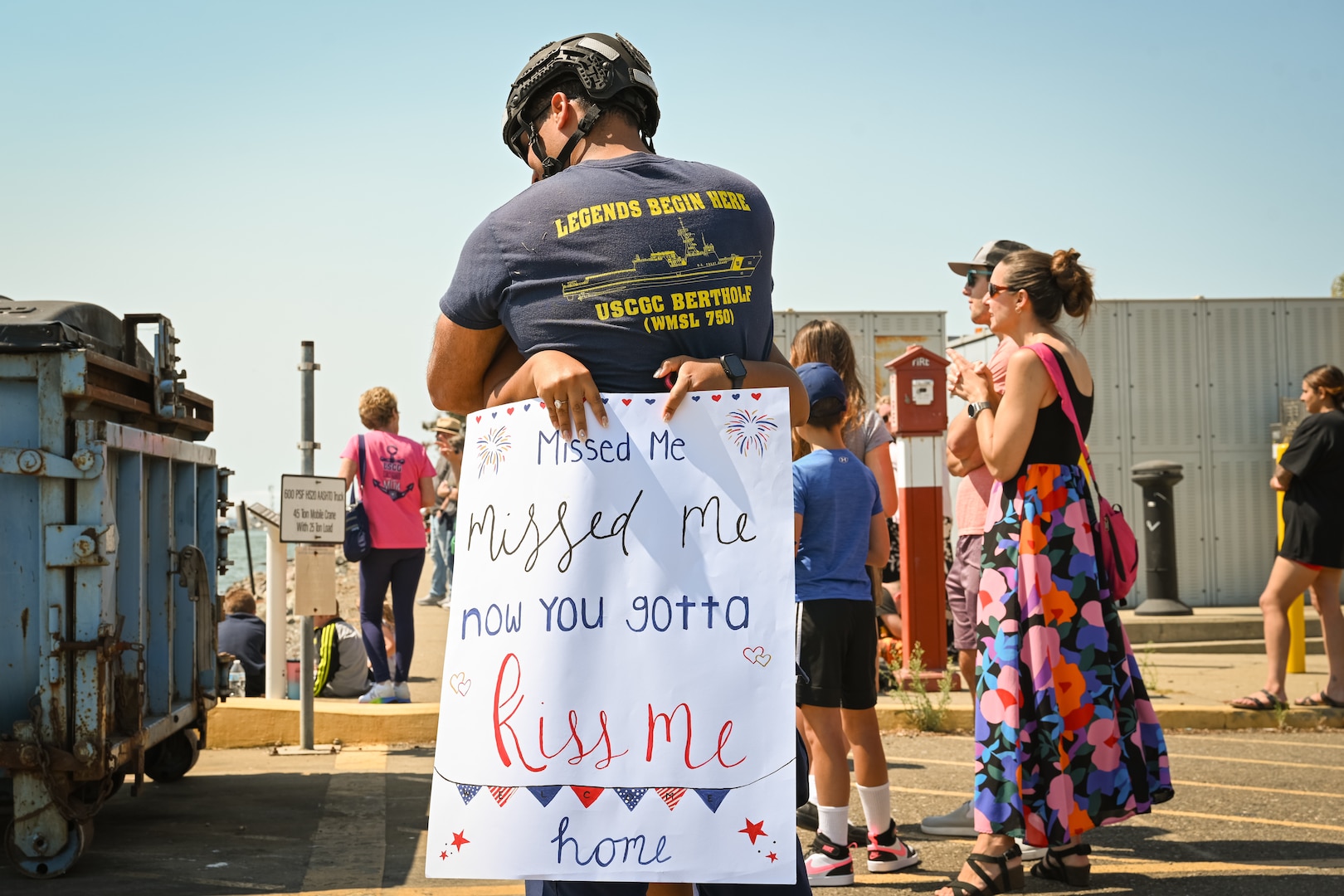 A crewmember attached to the United States Coast Guard Cutter Bertholf (WMSL 750) greets his significant other in Alameda, California, Aug. 10, 2025. The Bertholf participated in Operation BORDER TRIDENT - a Coast Guard-led interagency approach to detection, monitoring, interdiction, and apprehension operations to combat Transnational Criminal Organization and illegal migration activity in the California coastal region. (U.S. Coast Guard photo by Petty Officer 3rd Class Kenneth Wiese.)