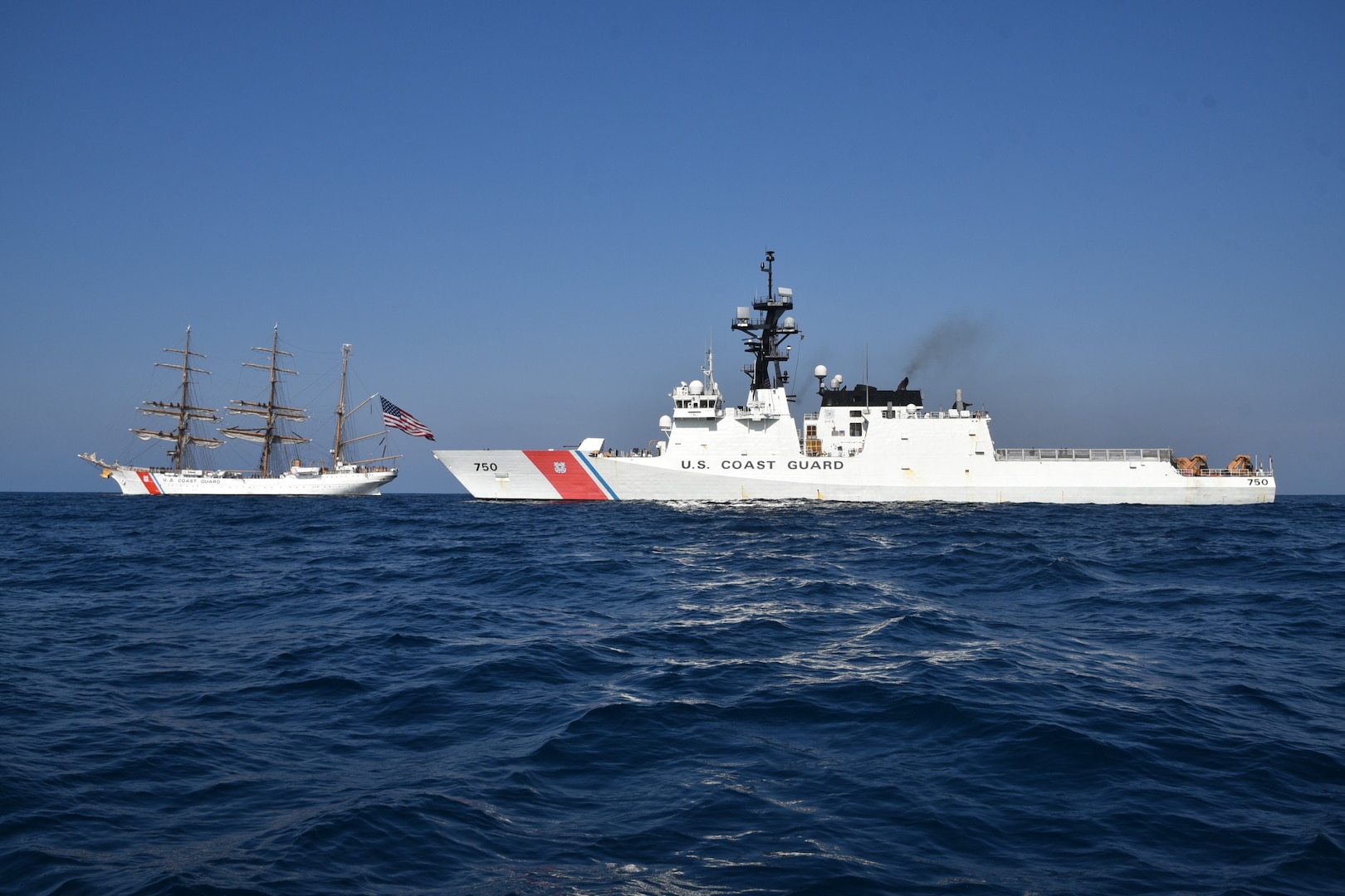 U.S. Coast Guard Cutter Bertholf (WSML 750) rendezvoused with U.S. Coast Guard Cutter Eagle (WIX 327) for a passenger exchange and formation steaming in the Pacific Ocean, August 6, 2025. Eagle is underway for her West Coast summer cadet tour, and Bertholf was nearing the completion of her Deployment in support of Operation Border Trident. (U.S. Coast Guard photo by Ensign Holli Welcker)