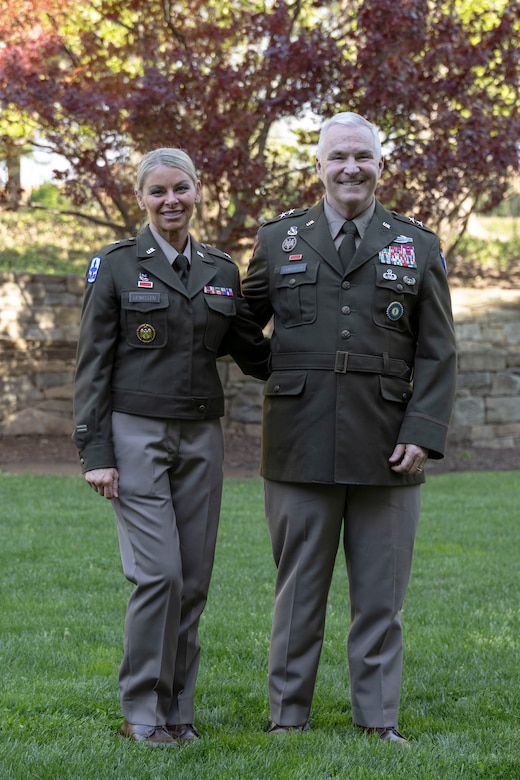 Col. Natalie Lewellen, deputy general counsel - Army National Guard Bureau stands with Maj. Gen Hal Lamberton during her promotion ceremony.