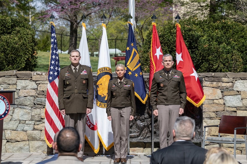 From left to right, Brig. Gen. Joseph Baldwin, deputy director Army National Guard Col. Natalie Lewellen deputy general counsel Army National Guard and Maj. Gen. Bobby Christine, judge advocate general Army stand during the playing of the national anthem.