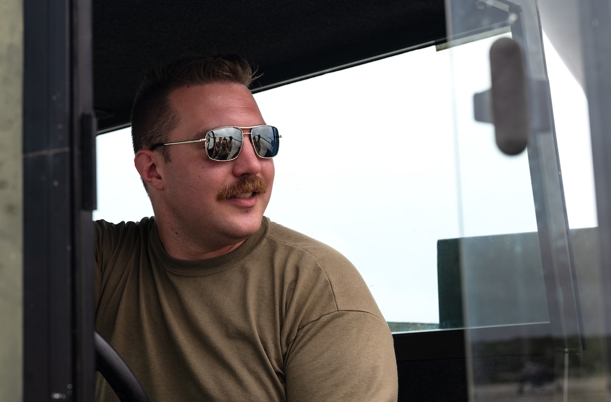 U.S. Air Force Staff Sgt. Andrew Potter, a flying crew chief assigned to the 22nd Aircraft Maintenance Squadron, speaks with other maintainers during the U.S. Air Force’s 2025 Department-Level Exercise series at Andersen Air Force Base, Guam, July 24, 2025. The DLE strengthens and demonstrates the U.S. Air Force’s ability to reach theater at speed and scale, sustain operations, and rapidly pivot to any theater of operation at a moment’s notice while maintaining the strategic initiative. The DLE series encompasses all branches of the Department of Defense, along with Allies and partners, employing more than 400 joint and coalition aircraft and more than 12,000 personnel across more than 50 locations across 3,000 miles. (U.S. Air Force photo by Staff Sgt. Tryphena Mayhugh)