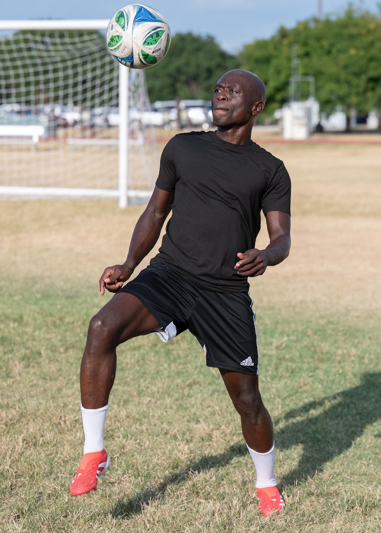 Senior Airman Ebenezer Owusu Arthur, 59th Medical Wing, juggles a soccer ball during a portrait session highlighting his participation in a military-only soccer tournament hosted by Major League Soccer’s Real Salt Lake.