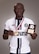 Senior Airman Ebenezer Owusu Arthur, 59th Medical Wing, displays a Commanders Cup medal and Most Valuable Player award following his performance in a military soccer tournament in Utah.