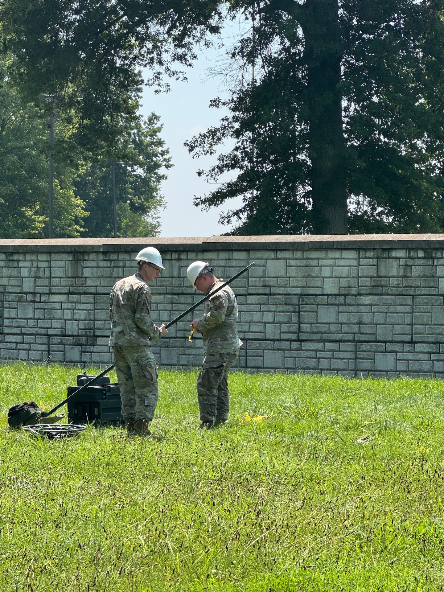 U.S. Air Force Airmen with the Kentucky National Guard's Chemical, Biological, Radiological, Nuclear and high-yield explosives (CBRNE) Enhanced Response Force Package (CERFP) Joint Incident Site Communications Capability (JISCC) team set up communications equipment to enable electronic communication throughout the area during their external evaluation at Muscatatuck Training Center, July 29 through Aug. 1, 2025.
