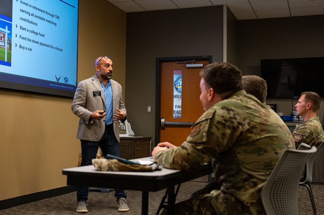 Mike Tucci, Military and Family Readiness Center personal financial counselor, gives Barksdale Airmen a post-deployment briefing at Barksdale Air Force Base, Louisiana, Aug. 6, 2025. Financial advice is one of the many services Airmen can receive from the Military and Family Readiness Center. (U.S. Air Force photo by Airman 1st Class Aaron Hill)