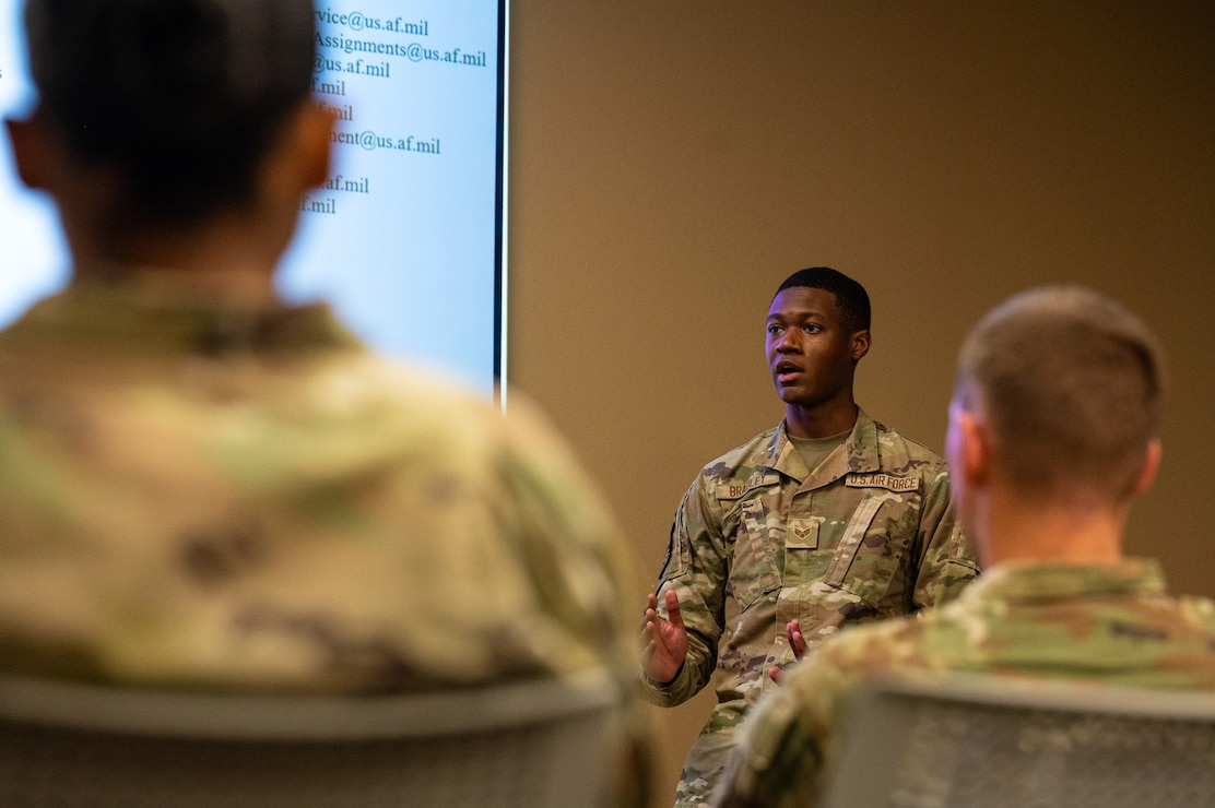 U.S. Air Force Senior Airman Jordan Bradley, 2nd Force Support Squadron commander support staff technician, briefs Barksdale Airmen during a post-deployment brief at Barksdale Air Force Base, Louisiana, Aug. 6, 2025. Post-deployment briefing give Airmen the necessary points of contact they need to help handle reintegration after deployment. (U.S. Air Force photo by Airman 1st Class Aaron Hill)