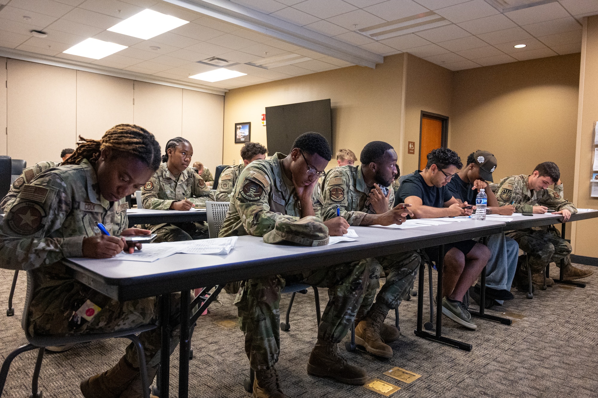 U.S. Air Force Airmen with the 2nd Bomb Wing attend a financial planning class  offered by the Military and Family Readiness Center at Barksdale Air Force Base, Louisiana, Aug. 7, 2025. Financial advice is one of the many services Airmen can receive from the Military and Family Readiness Center. (U.S. Air Force photo by Airman 1st Class Aaron Hill)