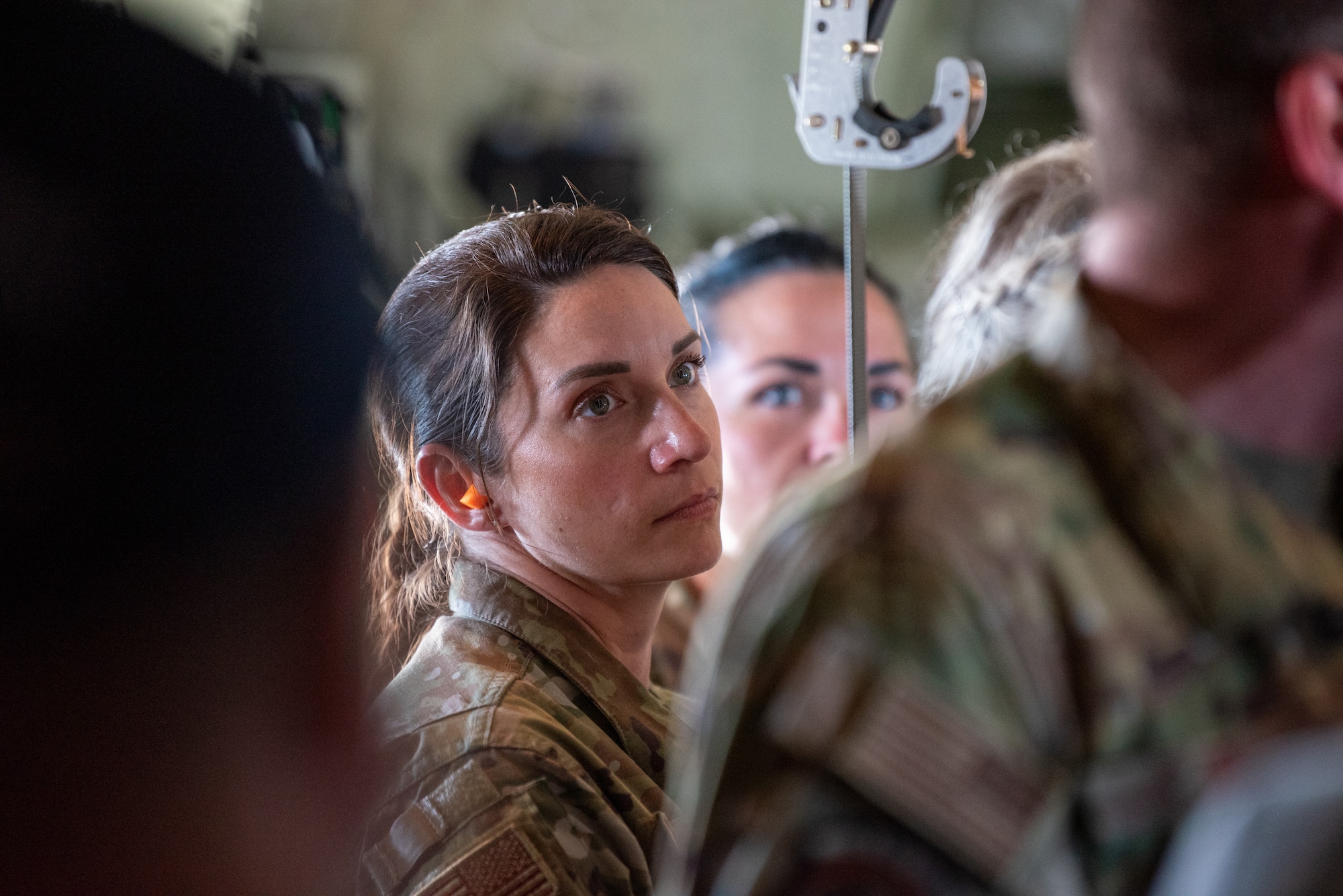 Capt. Leigha Bowyer-Jones, a nurse practitioner with the 123rd Medical Group, cares for a simulated patient aboard a Kentucky Air National Guard C-130J Super Hercules aircraft as a member of a Critical Care Air Transport Team on May 14, 2025. The scenario was part of an earthquake-response exercise being observed by a group of civilian employers, who were participating in an Employer Support of the Guard and Reserve “Bosslift,” a federal program designed to enhance their understanding of Guard missions by offering an inside perspective on military operations. (U.S. Air National Guard photo by Phil Speck)