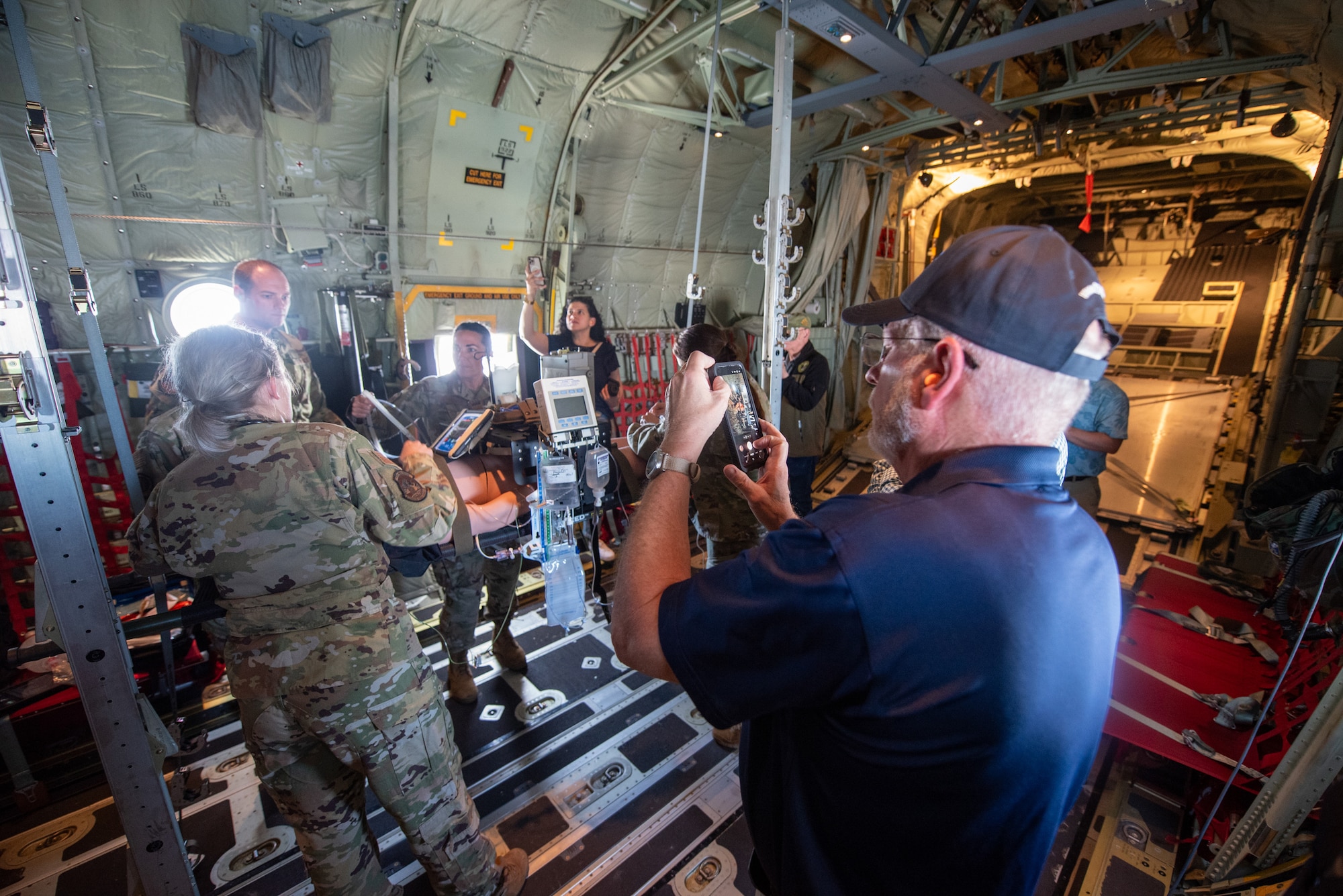 A group of civilian employers observe a Critical Care Air Transport Team from the 123rd Medical Group treat a simulated patient aboard a Kentucky Air National Guard C-130J Super Hercules aircraft May 14, 2025, as part of an earthquake-response exercise. The employers were participating in an Employer Support of the Guard and Reserve “Bosslift,” a federal program designed to enhance their understanding of Guard missions by offering an inside perspective on military operations. (U.S. Air National Guard photo by Phil Speck)