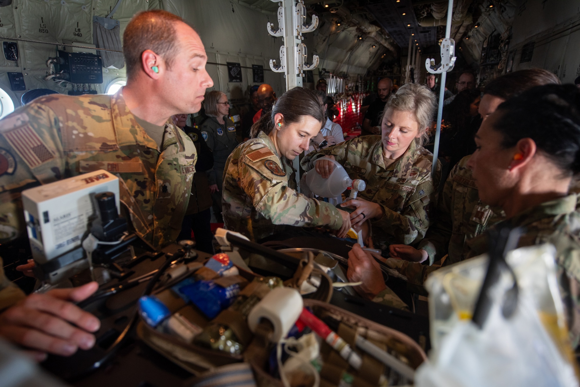 Members of a Critical Care Air Transport Team from the 123rd Airlift Wing care for a simulated patient aboard a Kentucky Air National Guard C-130J Super Hercules aircraft May 14, 2025. The scenario was part of an earthquake-response exercise being observed by a group of civilian employers, who were participating in an Employer Support of the Guard and Reserve “Bosslift,” a federal program designed to enhance their understanding of Guard missions by offering an inside perspective on military operations. (U.S. Air National Guard photo by Phil Speck)