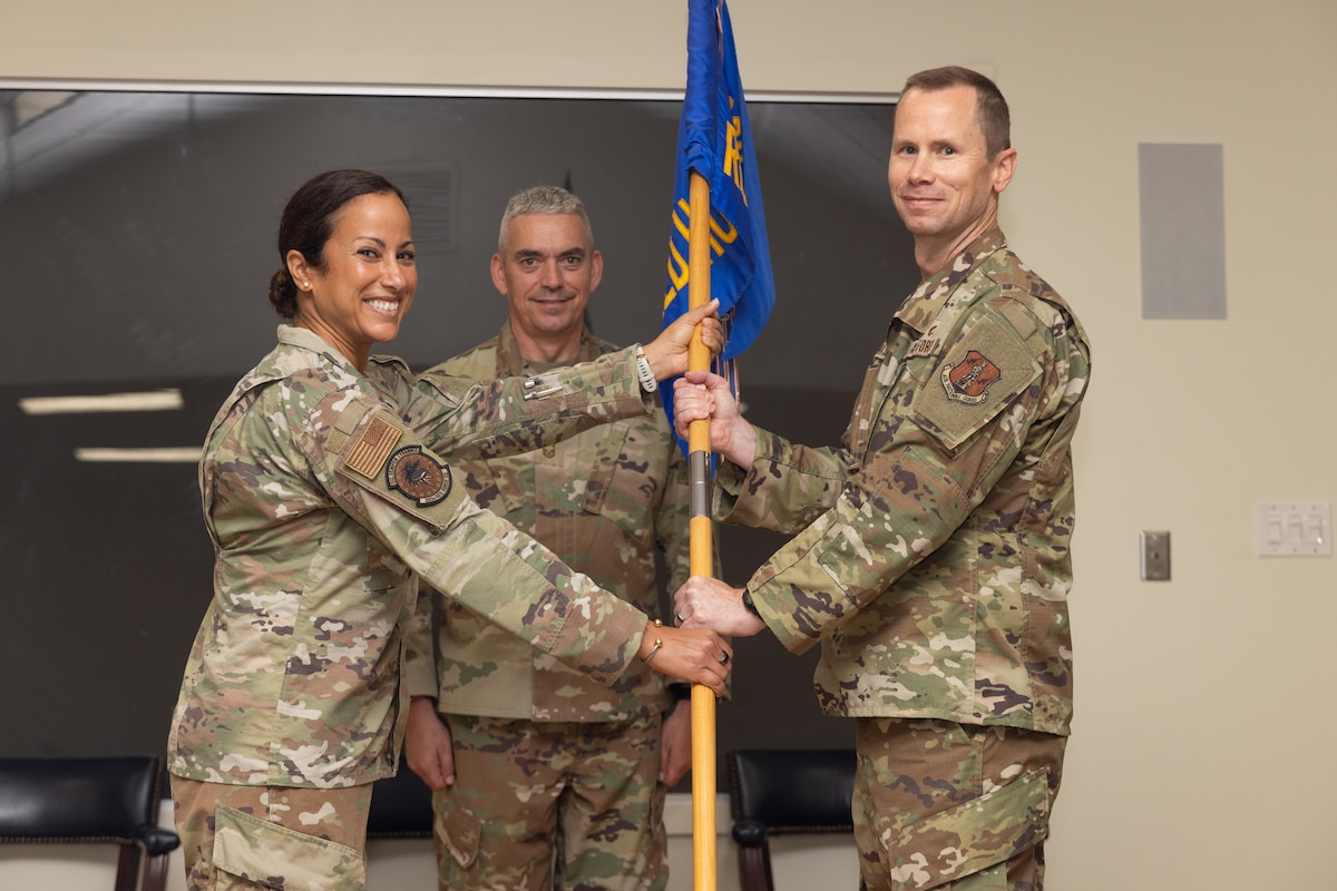 Nixon receiving guidon from Burge