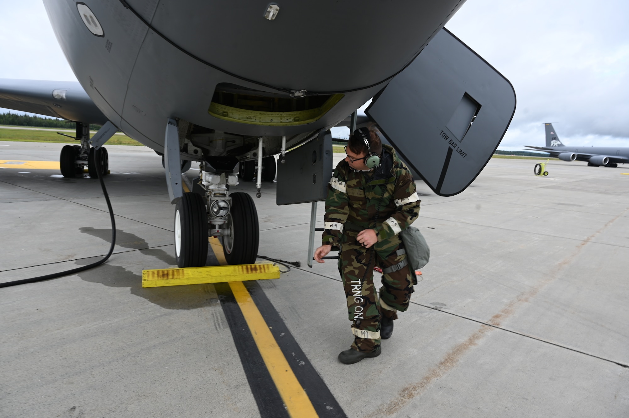 A 168th Wing crew chief launches a KC-135 Stratotanker during Arctic Raven 25-1.