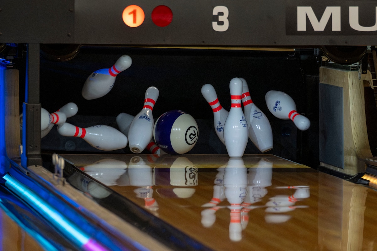 A bowling ball knocks over pins during a friendship bowling event at Misawa Air Base, Japan, Aug. 9, 2025.