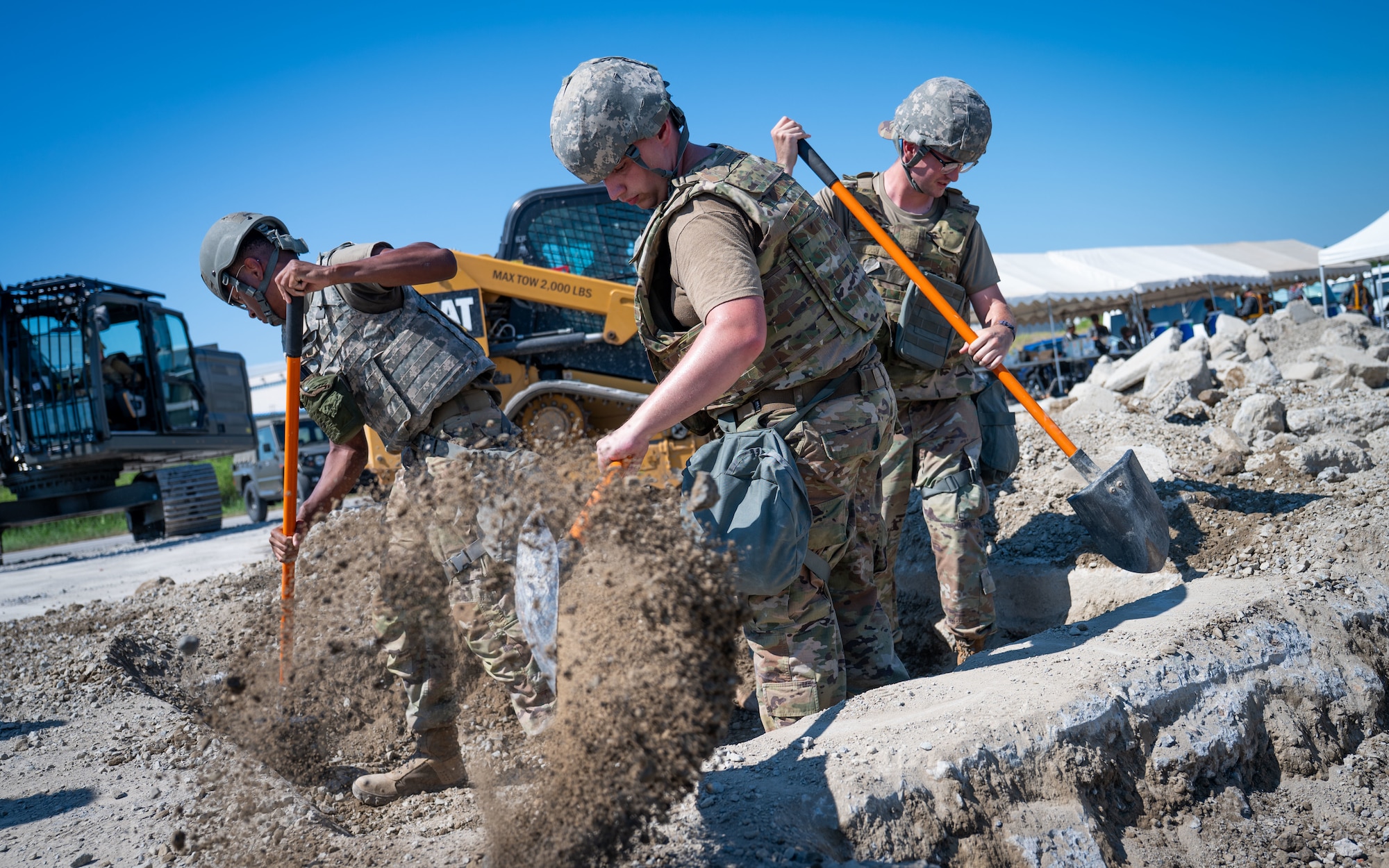 Airmen excavate a damaged section of runway.