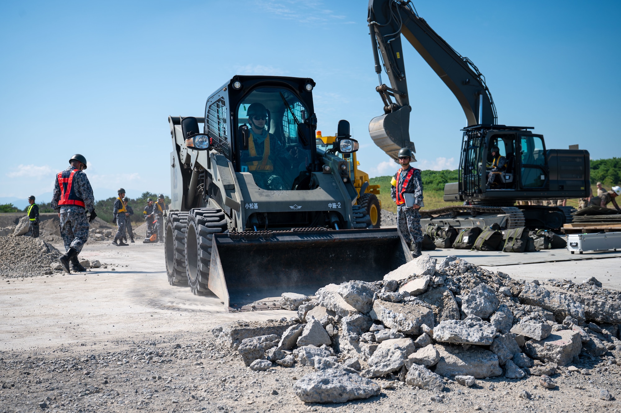 civil engineering personnel operate heavy machinery.