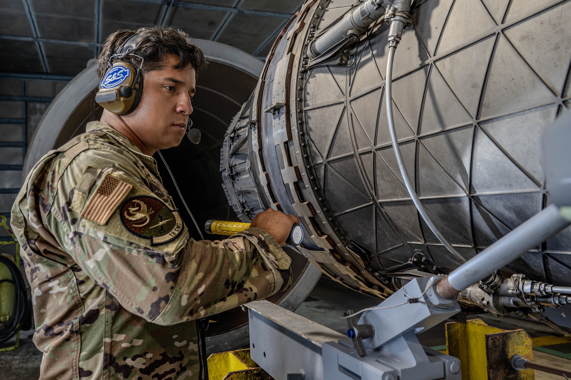 Service member inspects engine