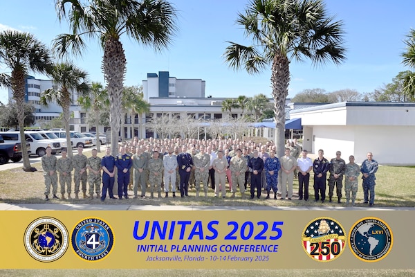U.S. Naval Forces Southern Command/U.S. 4th Fleet Commander Rear Adm. Carlos Sardiello, center, poses with the combined/joint planning team for a group photo at the UNITAS 2025 Initial Planning Conference in Jacksonville, Fla., February 12. This year's UNITAS, the longest-running multinational maritime exercise in the world, will combine the efforts of Allies and Partners from across the globe and serve as the introduction to Navy 250 - the U.S. Navy's year-long birthday celebration. U.S. Naval Forces Southern Command/U.S. 4th Fleet is the maritime component of U.S. Southern Command and the trusted maritime partner for Caribbean, Central, and South American maritime forces leading to improved unity, security, and stability.