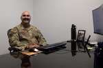 U.S. Air Force Master Sgt. Eric Tabor, 403rd Wing in service recruiter, sits at his desk on Keesler Air Force Base, Miss., July 22, 2025. Tabor has recently moved to Keesler AFB as an in service recruiter where his primary role is to inform active duty of the benefits of the Reserve and help them transition over. (U.S. Air Force photo by Senior Airman Shelby Jessee)